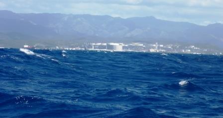 Huge oil facility behind the waves